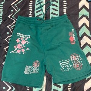 Green embroided shorts